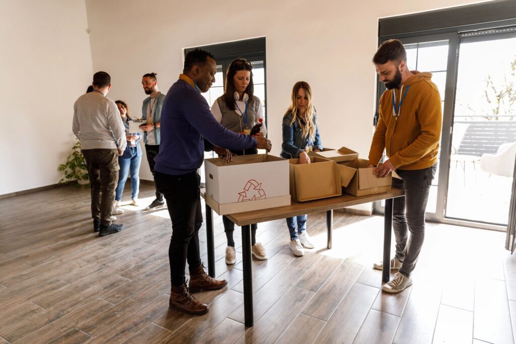 Diverse group of people working with donation boxes at the volunteer center