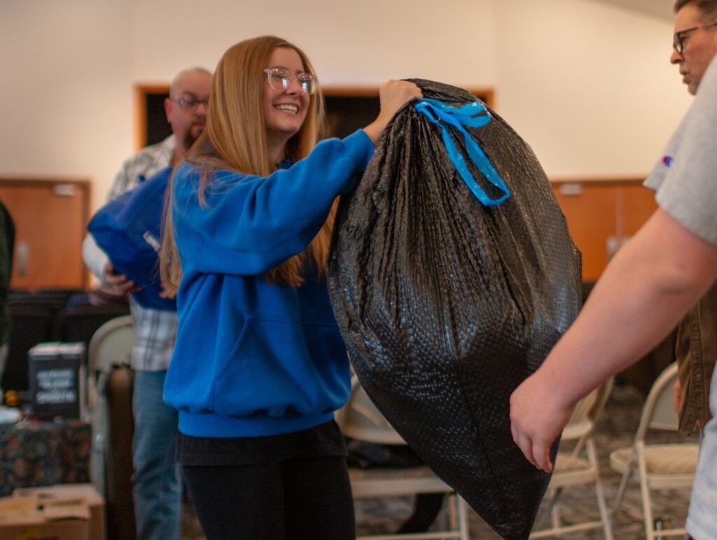 Circle C Relief team praying with community members during disaster relief response